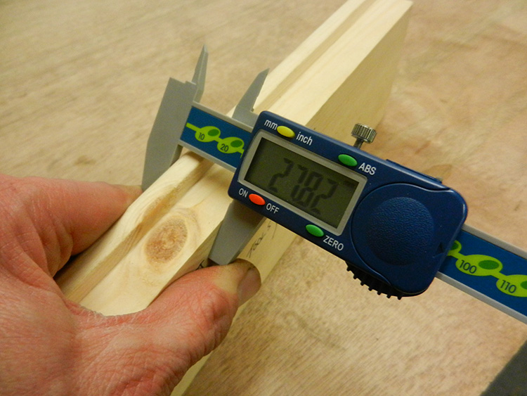 Precise measuring tool being used on planed timber